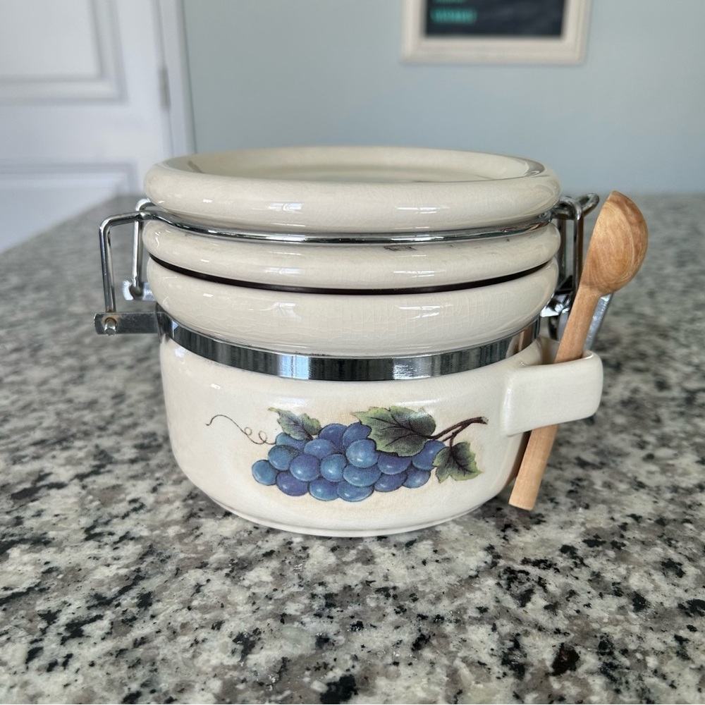 Vintage Ceramic Kitchen Canister with Grape Design and Wooden Spoon